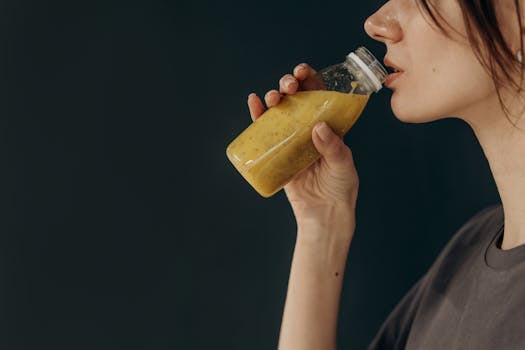 athlete enjoying a smoothie post-workout